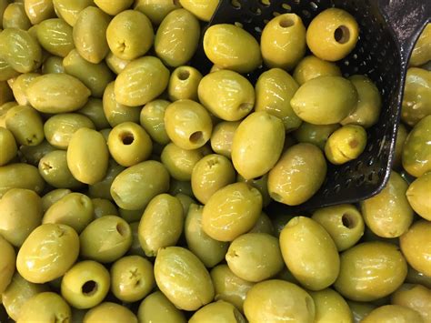 The olive - Some platforms show a solitary pitted green olive stuffed with a piece of a pimento pepper. Can be used to talk about olives or the color green. Olive was approved as part of Unicode 13.0 in 2020 and added to Emoji 13.0 in 2020.